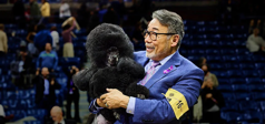 Miniature Poodle named “Sage” and her handler Kaz Hosaka