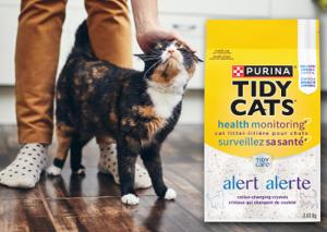 cat next to the tidy cats alert product bag