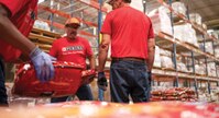 A group of Purina employees in a warehouse